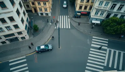 Mestská križovatka zhora s autom a chodcami